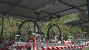 Bicycle parked in double-decker modern parking lot on second level. Bicycle infrastructure. Modern two level bicycle parking. Dual stack cycle rack. Bike station. Split level bicycle parking lot. video