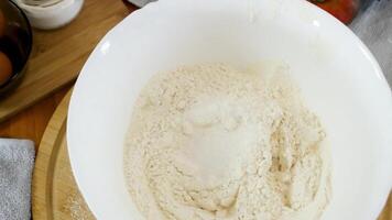 Adding spices to flour. Preparing a baking mixture. video