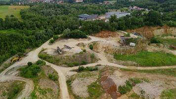Aerial view of an abandoned mining quarry in Germany im Landkreis Dillingen. Open pit mines drone view. Steinbruch Luftaufnahme in Deutschland, Bayern in der Stadt Haunsheim. Mining equipment. video