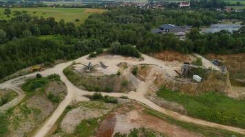 Aerial view of an abandoned mining quarry in Germany im Landkreis Dillingen. Open pit mines drone view. Steinbruch Luftaufnahme in Deutschland, Bayern in der Stadt Haunsheim. Mining equipment. video