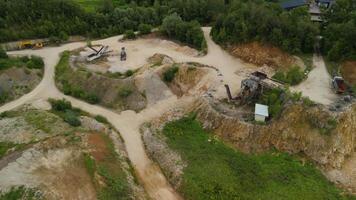 Aerial view of an abandoned mining quarry in Germany im Landkreis Dillingen. Open pit mines drone view. Steinbruch Luftaufnahme in Deutschland, Bayern in der Stadt Haunsheim. Mining equipment. video