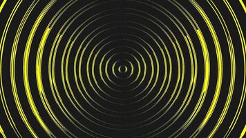 A black and yellow abstract background with a circular pattern video