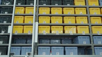 Smart warehouse management system with robotic handling system. Automated robotic tote arranging distribution product stock on shelf in modern factory. AI Technology Logistic concept. video