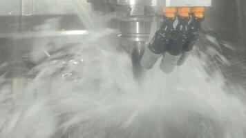 Demonstrate of CNC milling machine cutting the steel parts with water coolant method. video