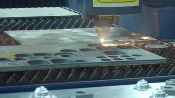 Demonstration of automated Laser CNC cut of metal with light beams technology modern industrial. High precision CNC Laser beam engraving cutting of heavy metal sheet with spark. Metal working plant. video