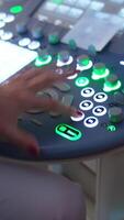 Modern ultrasound machine with multiple light buttons. Doctor quickly pressing the keys at apparatus while moves the device in other hand on pregnant belly. Vertical video