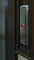 Man's hand presses a lift button. Man pressing elevator button in office center or hotel. Progress future startup concept. Close-up. Vertical video