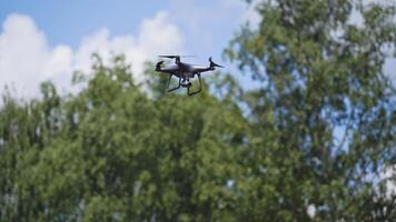 Electric drones flies in the sky. Quadcopter with camera flying in sky video