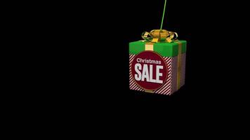 Red and green gift box with Christmas Sale sign hanging on green string against transparent background. 3D animation video