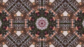 A symmetrical floral pattern surrounding a central structure, creating a visually striking design. video