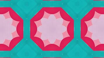 A symmetrical abstract pattern featuring pink and yellow geometric shapes. video