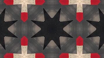 A symmetrical abstract design featuring red, black, and beige shapes. video