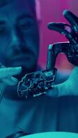 A Prosthetic Hand Holds a Fragile Part video