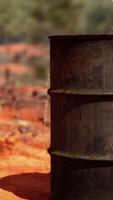 old empty rusted barrel on sand video