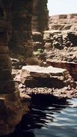 the river flowing through the valley of huge red rocks video