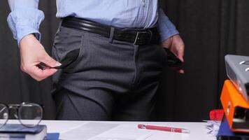 Office worker showing his empty pockets after losing all his money, having financial problems and being fired after bankruptcy. Businessman showing empty pockets after bankruptcy in office video