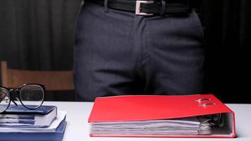 close-up Concept boss loads subordinate with additional work in the office. Heavy routine monotonous office work with documents. Archive of documents in a stack. Work pressure, stress at work video