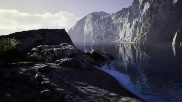 Serene landscape of rocky shore and tranquil water in Australia at dawn video