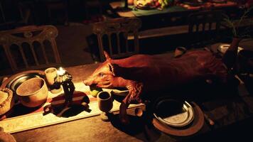 A festive dining table adorned with various foods and drinks at twilight video