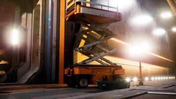 Construction equipment in a well lit industrial workspace setting video