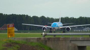 An unrecognizable plane on the runway. The passenger airliner is ready for takeoff. Spotting video