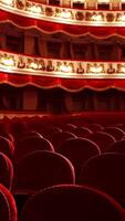 Classical theater with no audience during lockdown. Empty seats in the opera house. Beautiful theatrical hall with rows of red chairs. Consequences of the pandemic. Vertical video