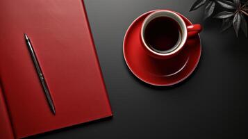 simple yet elegant workspace featuring red notebook, sleek pen, and vibrant red coffee cup on dark surface. This setup evokes sense of focus and creativity photo