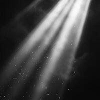 Bright beams of light pierce through dark atmosphere, creating stunning contrast with floating particles. ethereal quality evokes sense of wonder and tranquility photo