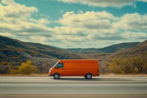 cinematic image of orange cargo van driving on highway surrounded by mountains and trees. scene captures sense of adventure and freedom photo