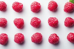 Fresh and glistening raspberries arranged in neat pattern, showcasing their vibrant red color and juicy texture, perfect for culinary use or healthy snacking photo