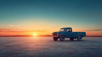 vintage pickup truck parked on vast, empty landscape at sunset, creating serene and nostalgic atmosphere photo