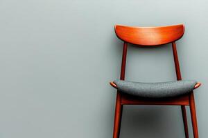 Modern upholstered dining chair with dark wood frame and gray cushion, perfect for contemporary interiors. Stylish and functional design enhances any space photo