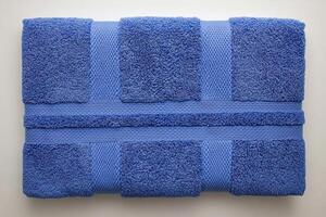 Soft oversized cotton bath towel in rich navy blue, perfect for adding comfort and style to your bathroom decor. Ideal for drying off after shower or bath photo
