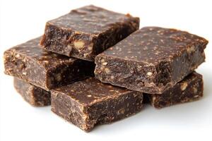 Rich dark chocolate squares stacked together, showcasing delightful texture and hint of nuts. Perfect for chocolate lovers seeking indulgence photo