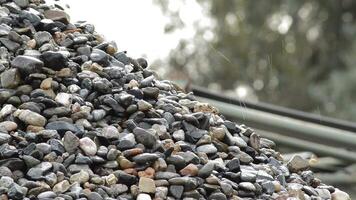 Pebbles and stones falling in a pebbles mountain in a sand quarry video