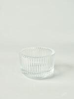 One empty clear transparent round bowl container object isolated on vertical copy spaced white background. photo