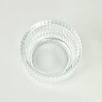 One empty clear transparent round bowl container object isolated on white background. photo