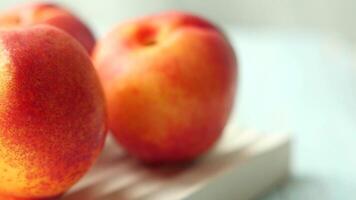 Fresh and Juicy Apples Displayed Beautifully on a Light Wooden Surface Background video