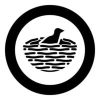 Bird's nest with bird icon in circle round black color illustration image solid outline style vector
