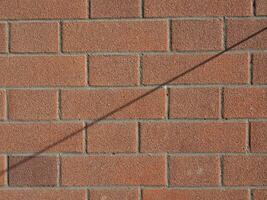 wire shadow on brick wall photo