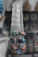 A necklace with many different colored beads hanging from it photo
