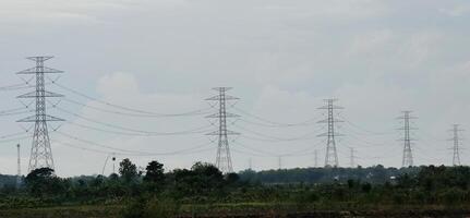 clouds and the silhouette of a power transmission tower. photo