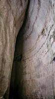 The Ear of Dionysius is an artificial cave located in the ancient stone quarry called latomia del Paradiso, under the Greek Theater of Syracuse. Dug into the limestone, it is about 23 m high photo