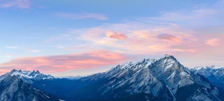 Beautiful snow capped mountains against the twilight sky at Banff National Park in Alberta, Canada. photo