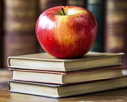 Technology-based learning. Fresh red apple on stacked books, symbolizing knowledge and learning. vibrant color of apple contrasts beautifully with vintage books, creating warm and inviting atmosphere photo