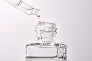 Close-up of a cosmetic bottle with a pipette showing the texture of the serum. photo