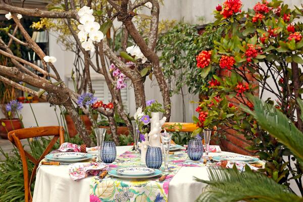 sophisticated and colorful table setting for lunch in the garden
