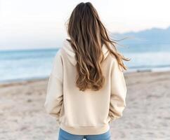 Woman enjoying serene beach view at sunset with gentle breeze photo