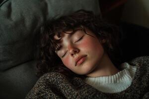Relaxing moments of a young person napping on a cozy couch photo