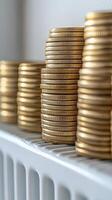 Stacks of gold coins arranged on a white surface in a close-up view photo